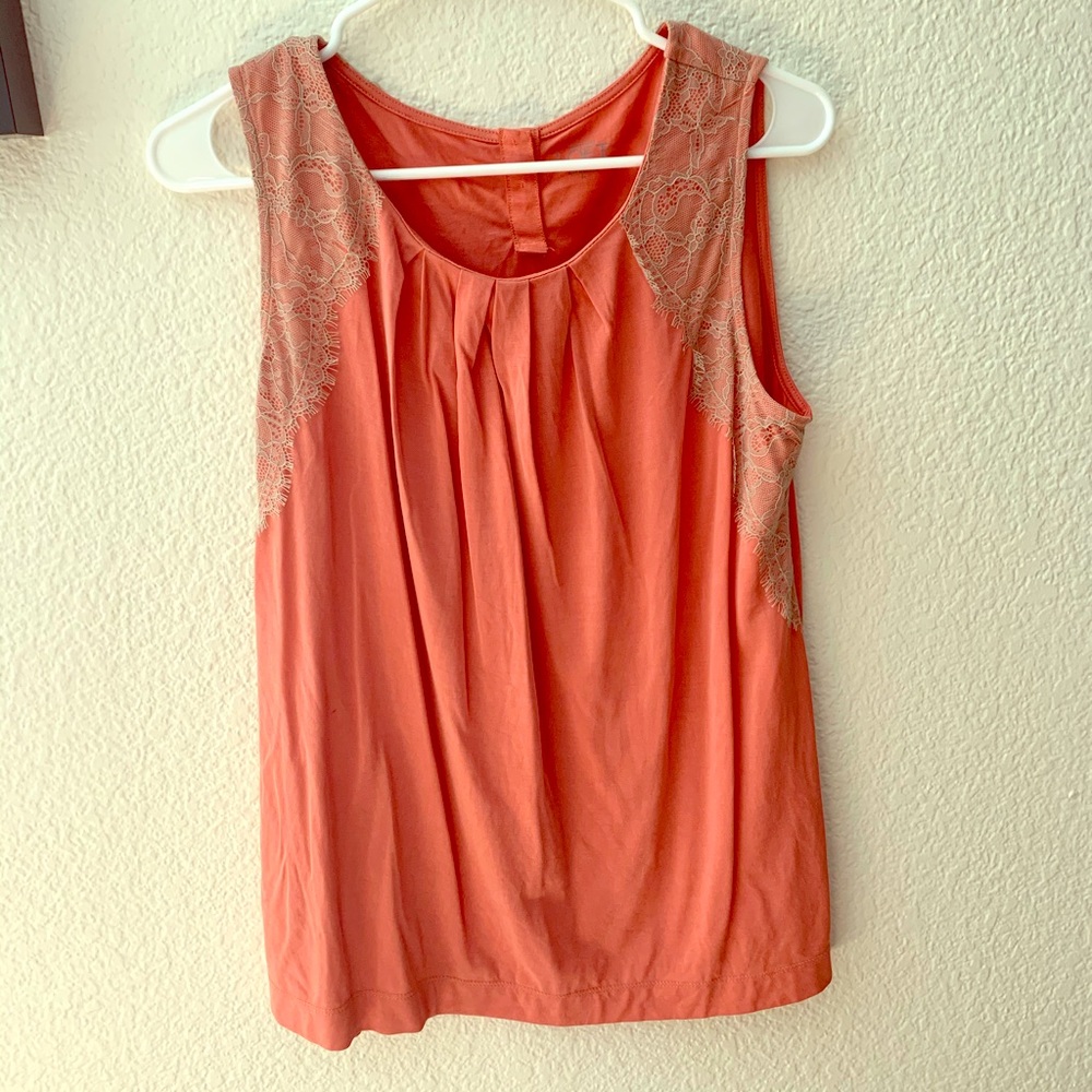 Salmon colored sleeveless blouse